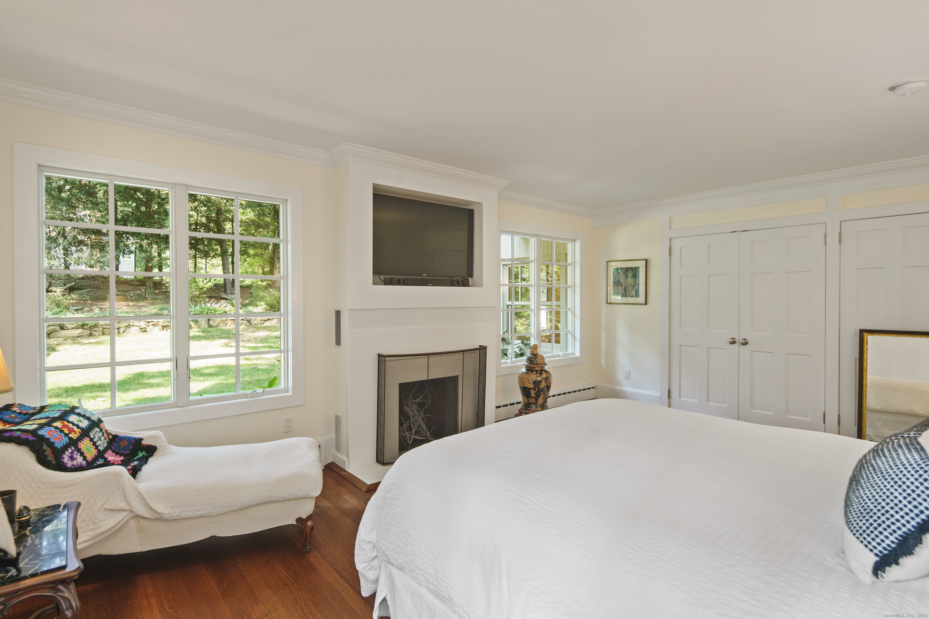 58 Kent Road Wilton, CT 06897 - Photo 10 of 19 a bedroom with a bed and a fireplace