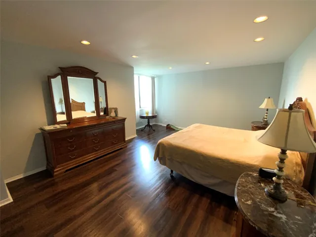 a bedroom with bed and window