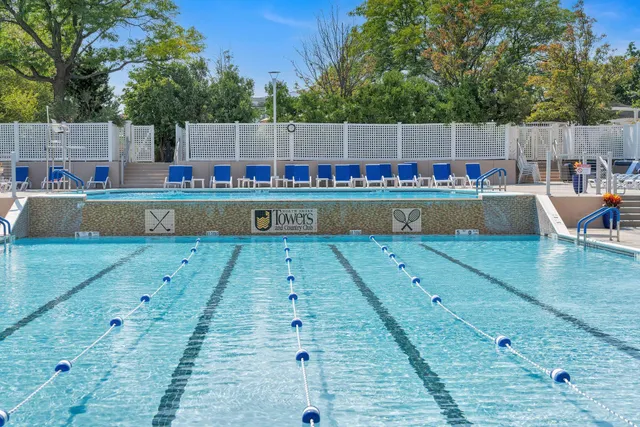 a view of a swimming pool with a chairs