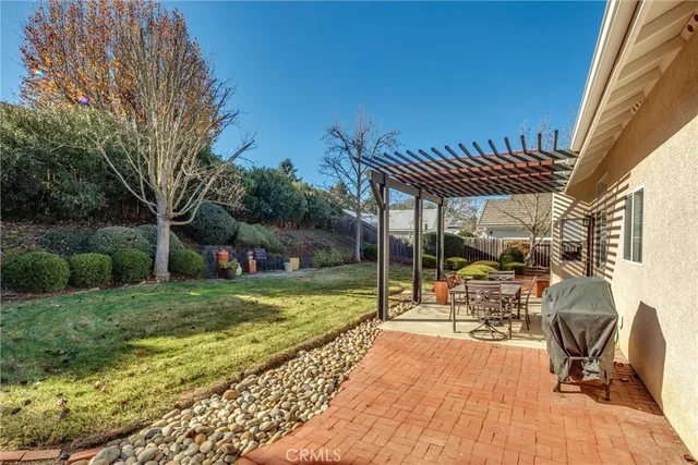 a view of a backyard with sitting area