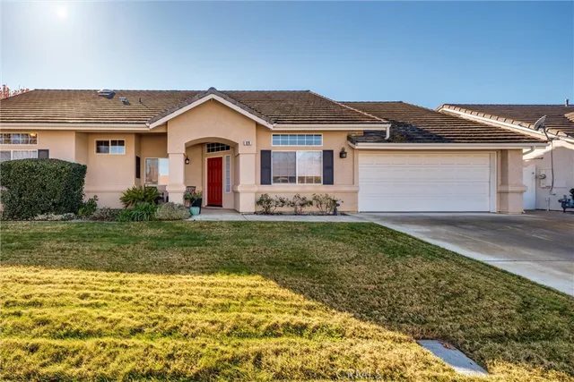 an aerial view of a residential houses with city view