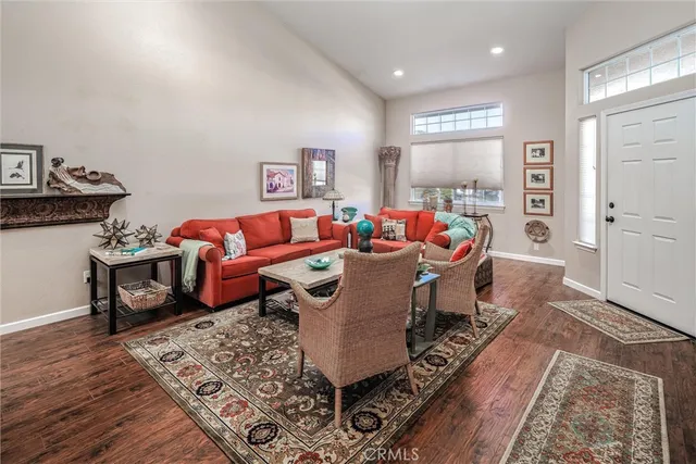 a dining room with furniture and wooden floor