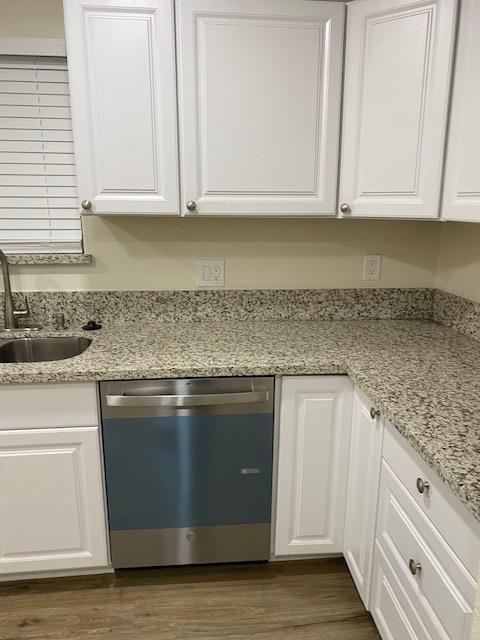 15792 Raymond Road Madera, CA 93638 - Photo 7 of 18 a kitchen with granite countertop a sink and cabinets