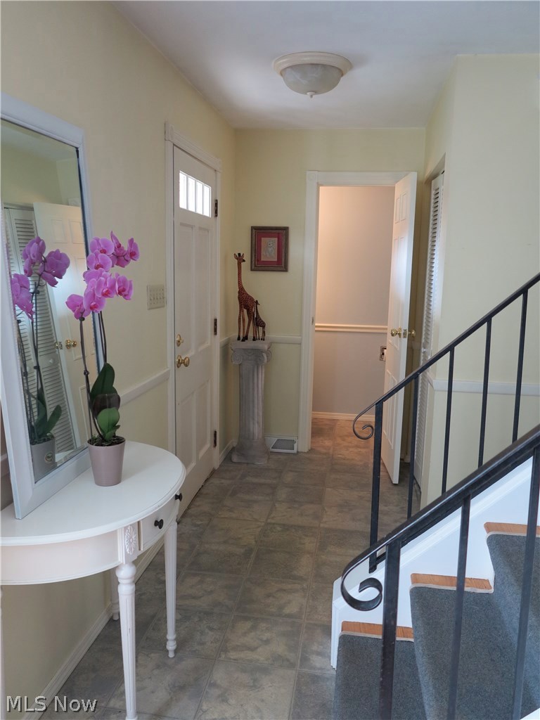 5710 Caranor Road Kent, OH 44240 - Photo 19 of 35 Foyer leading out from the Living Room to the Front Door and Half Bath.