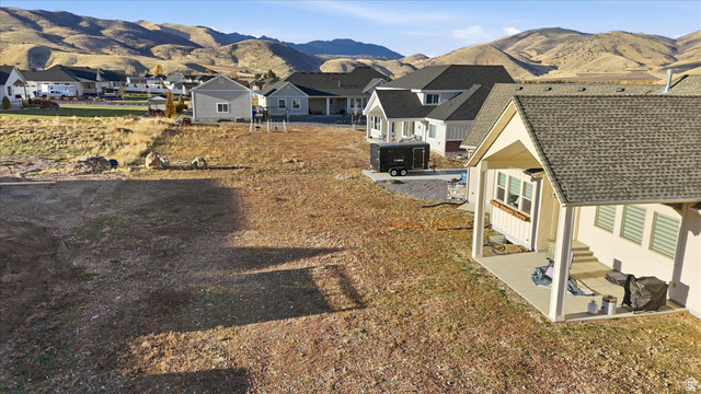 534 East Fish Hatchery Road Mantua, UT 84324 - Photo 65 of 87 View of yard featuring a patio area, a mountain view, and a residential view