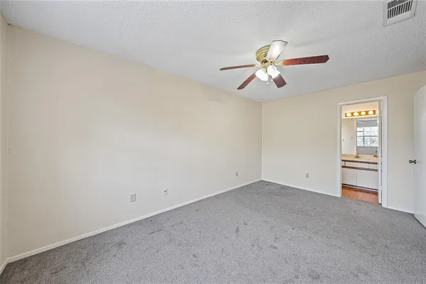 a view of a chandelier fan in a room