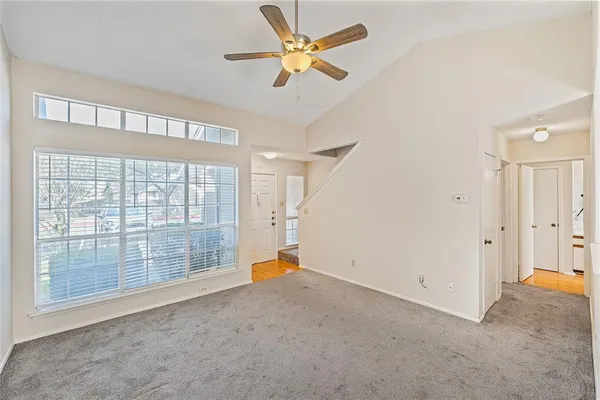 a view of an empty room with a window