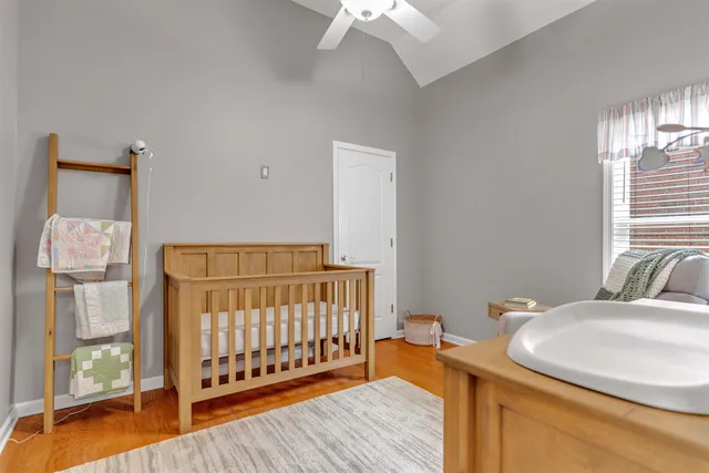 a bedroom with furniture and a window