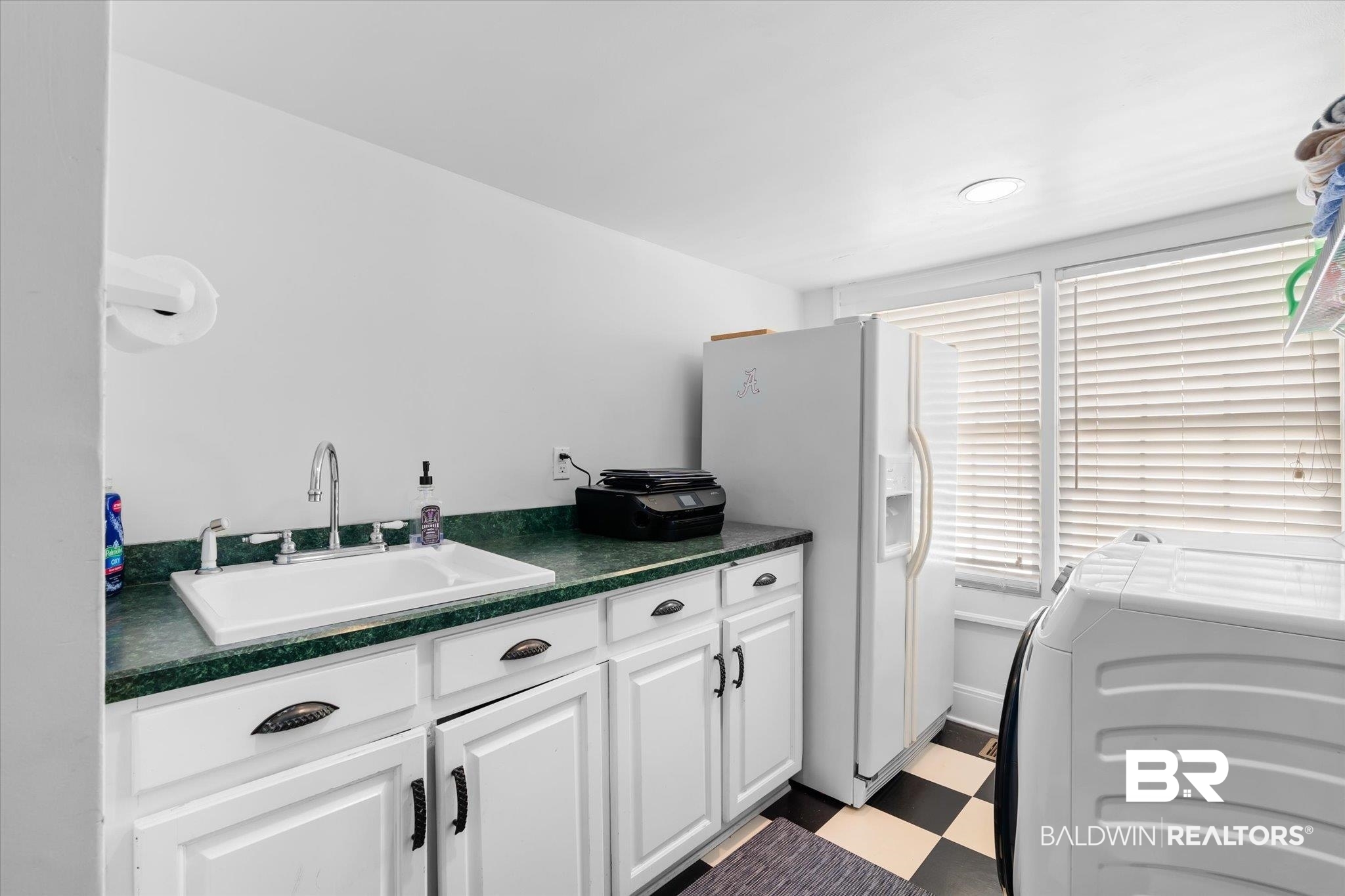 202 Woodlands Avenue Mobile, AL 36607 - Photo 26 of 53 Kitchen featuring white cabinets, sink, white refrigerator with ice dispenser, and washer and clothes dryer