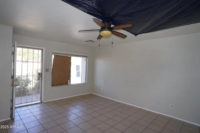a large white kitchen with a large window