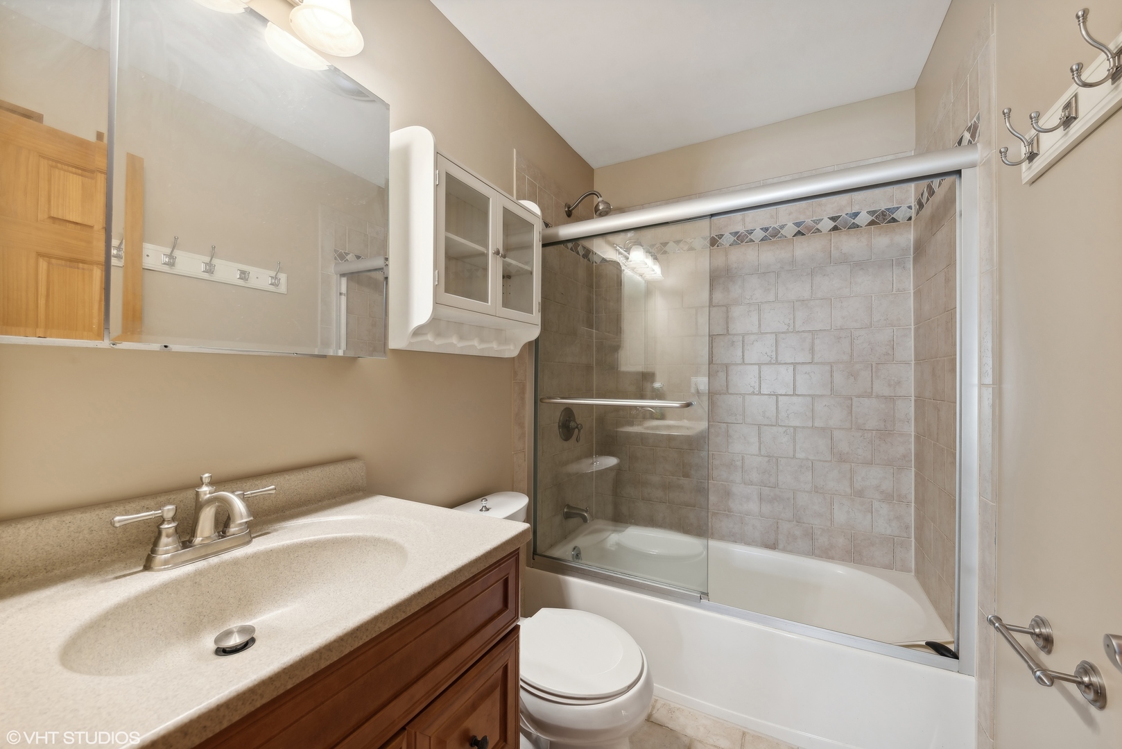 602 Forum Drive Roselle, IL 60172 - Photo 12 of 15 a bathroom with a sink toilet and shower