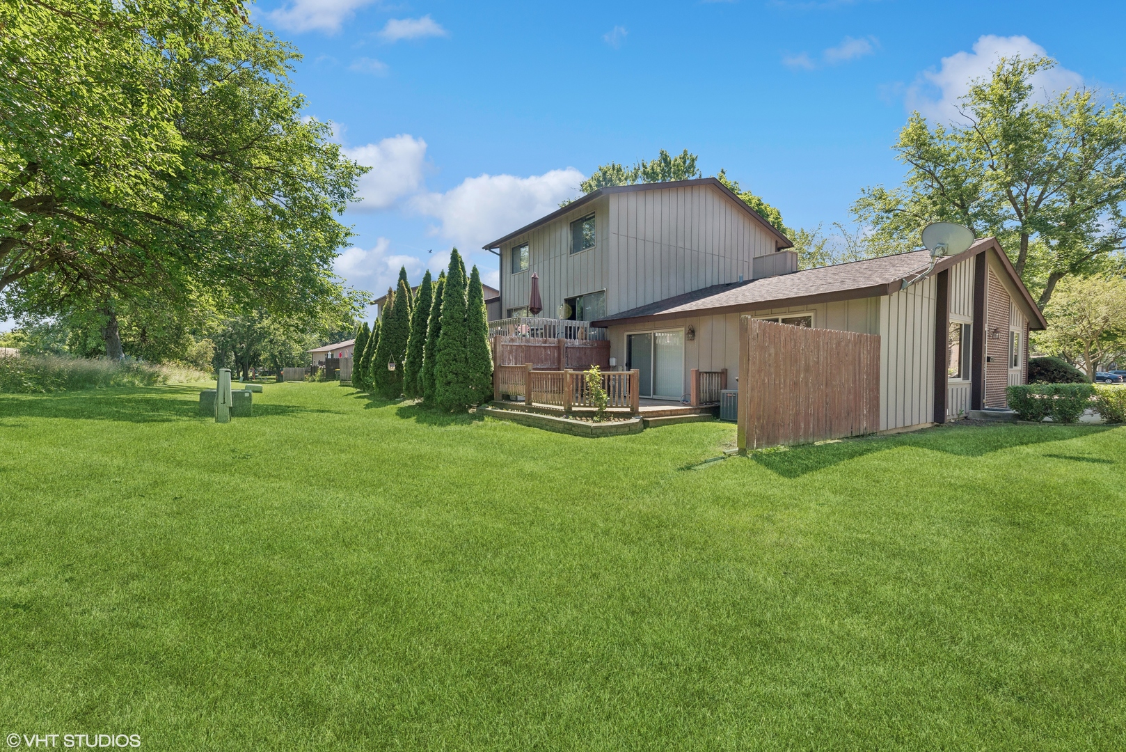 602 Forum Drive Roselle, IL 60172 - Photo 15 of 15 a view of a house with a big yard potted plants and large tree