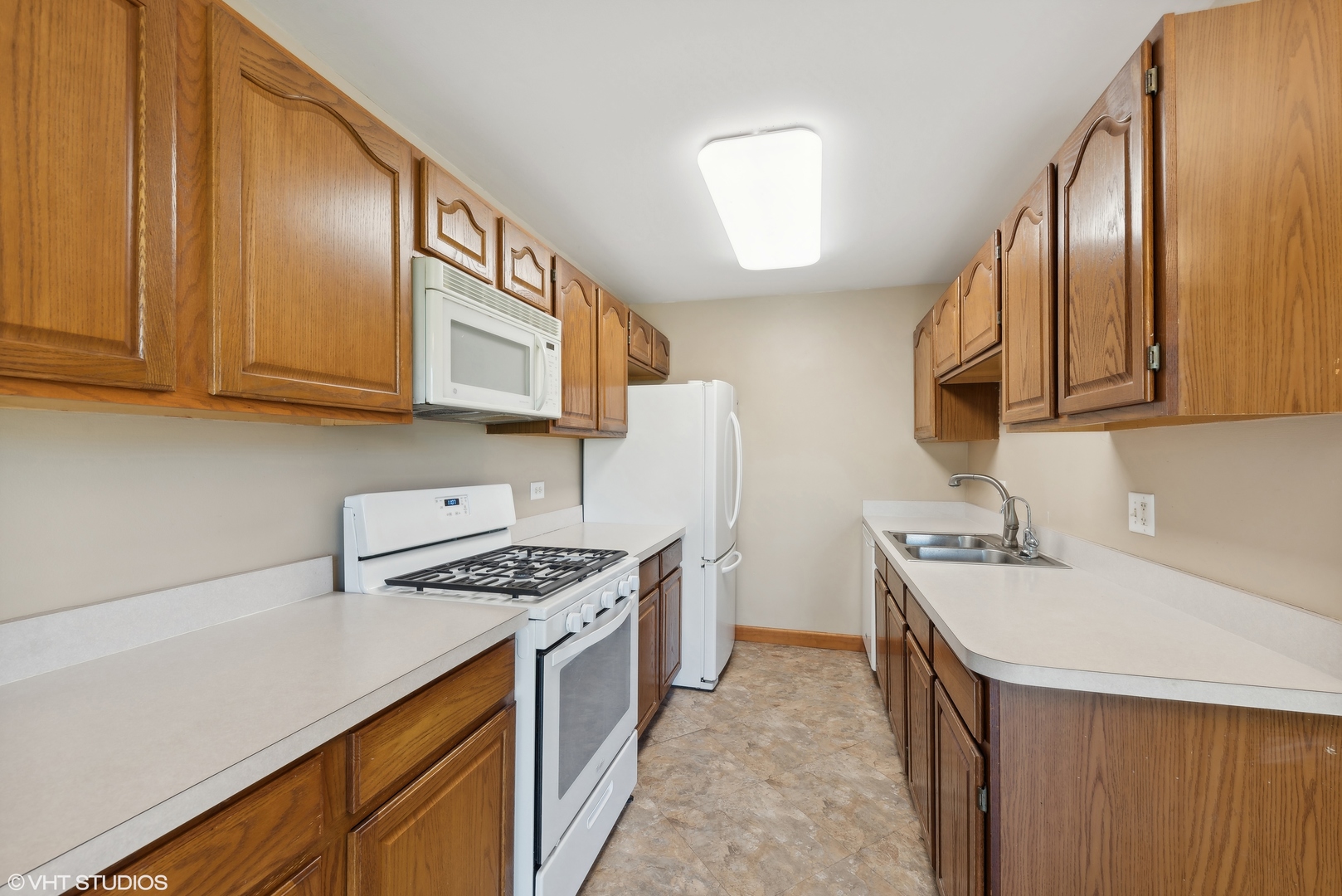 602 Forum Drive Roselle, IL 60172 - Photo 7 of 15 a kitchen with stainless steel appliances granite countertop a sink stove and cabinets