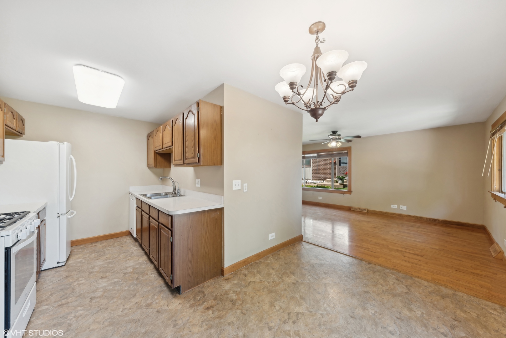 602 Forum Drive Roselle, IL 60172 - Photo 8 of 15 a kitchen with stainless steel appliances granite countertop a stove oven and a refrigerator