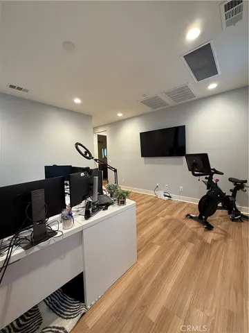 a room with furniture and a flat screen tv