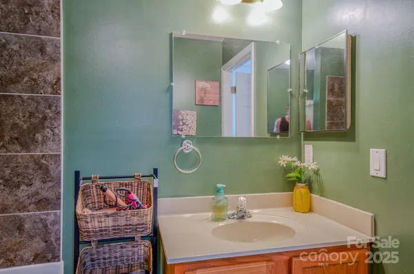 a bathroom with a sink and a mirror