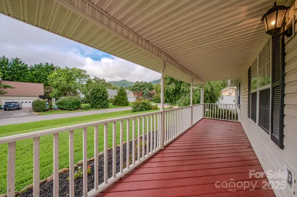 a view of balcony with wooden floor