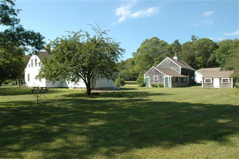143 Shore Road Bourne, MA 02532 - Photo 1 of 35 a front view of a house with a yard