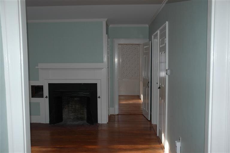 143 Shore Road Bourne, MA 02532 - Photo 18 of 35 a view of a livingroom with wooden floor and a fireplace