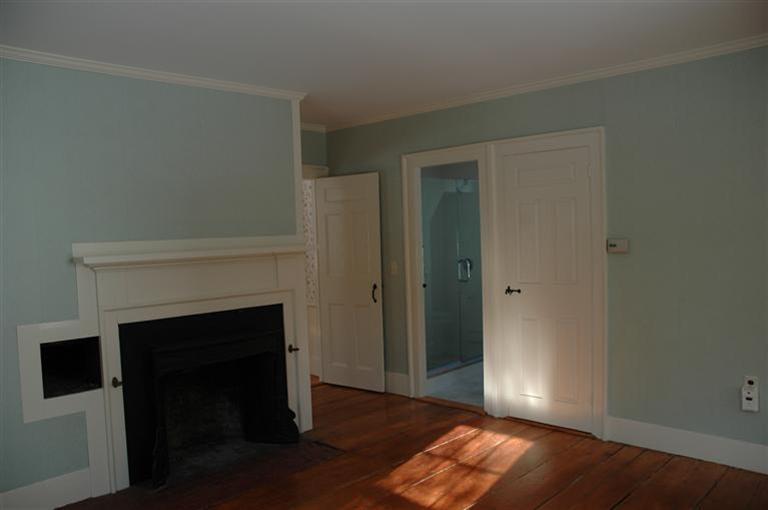 143 Shore Road Bourne, MA 02532 - Photo 19 of 35 a view of empty room with wooden floor and fireplace