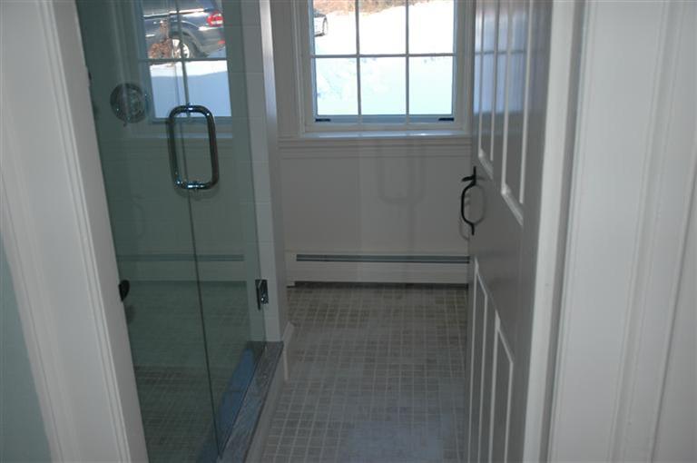 143 Shore Road Bourne, MA 02532 - Photo 20 of 35 a bathroom with a glass shower door