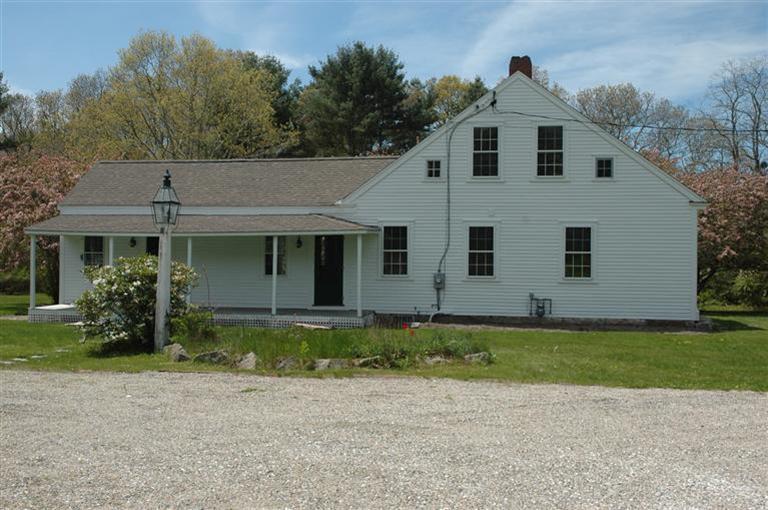 143 Shore Road Bourne, MA 02532 - Photo 2 of 35 a front view of a house with a yard
