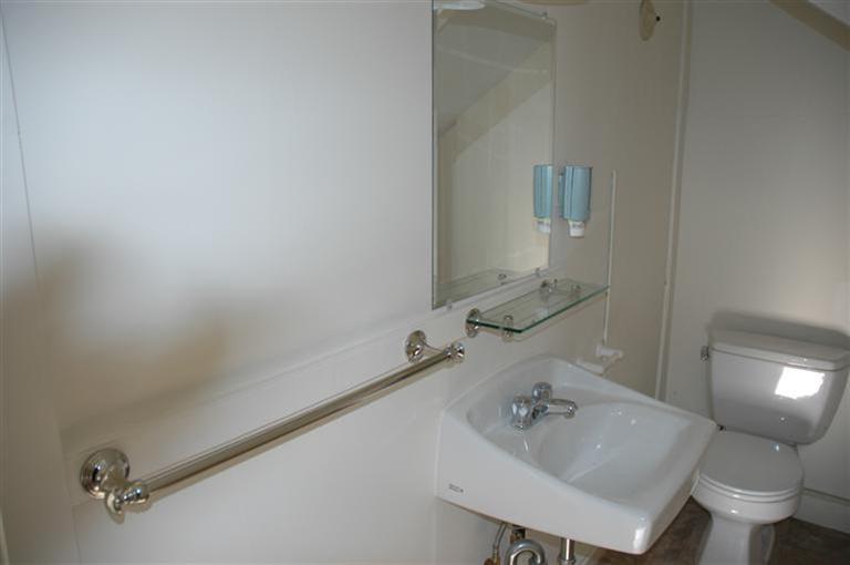 143 Shore Road Bourne, MA 02532 - Photo 28 of 35 a bathroom with a sink a toilet and a mirror
