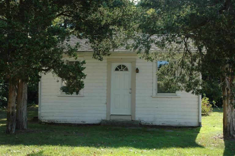 143 Shore Road Bourne, MA 02532 - Photo 29 of 35 front view of a house with a yard