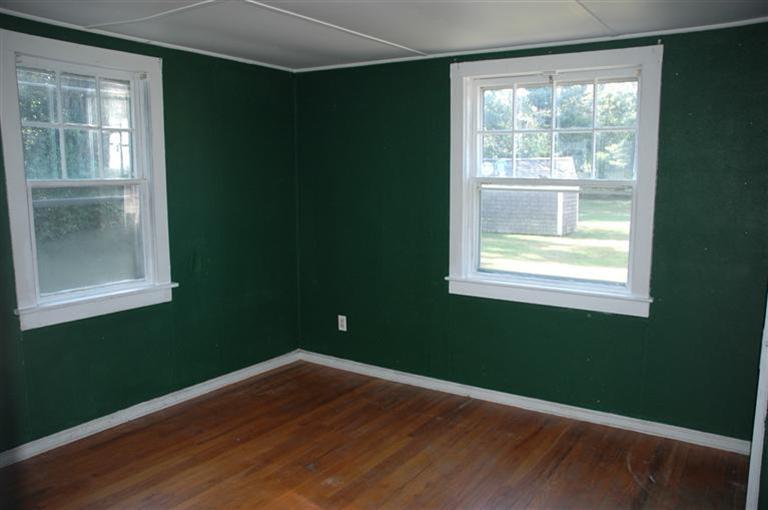 143 Shore Road Bourne, MA 02532 - Photo 32 of 35 a view of a room with wooden floor and windows