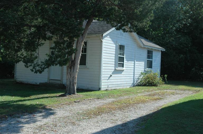 143 Shore Road Bourne, MA 02532 - Photo 5 of 35 a house view with a garden space