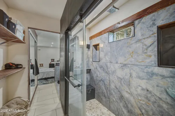 a bathroom with a tub and shower