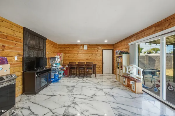 a living room with fireplace furniture and a flat screen tv