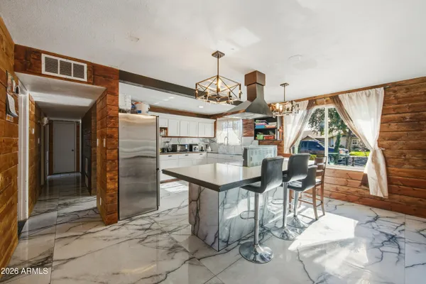 a open kitchen with granite countertop breakfast area