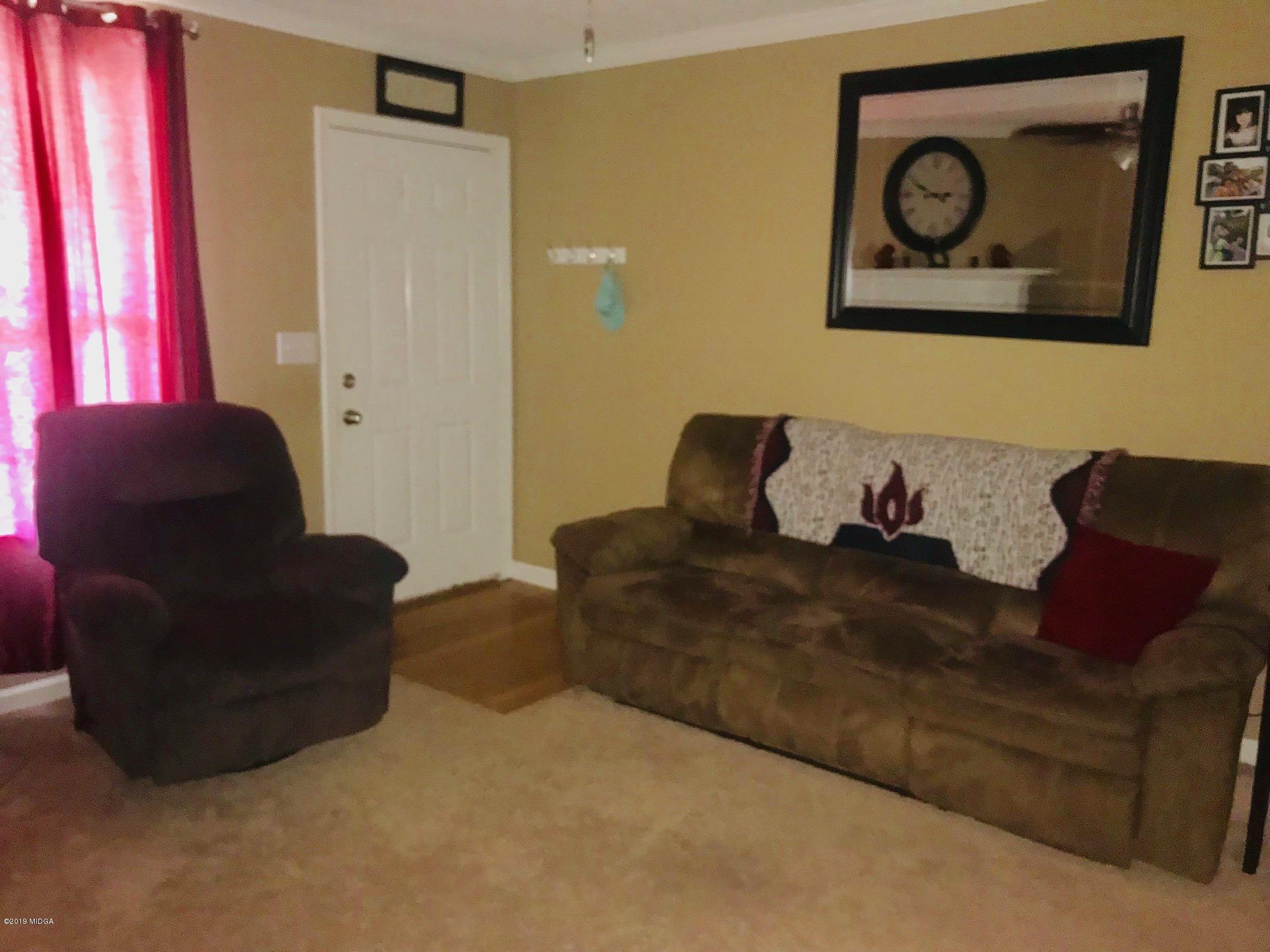 255 Autumn Ridge Court Gray, GA 31032 - Photo 3 of 16 a living room with furniture and a window