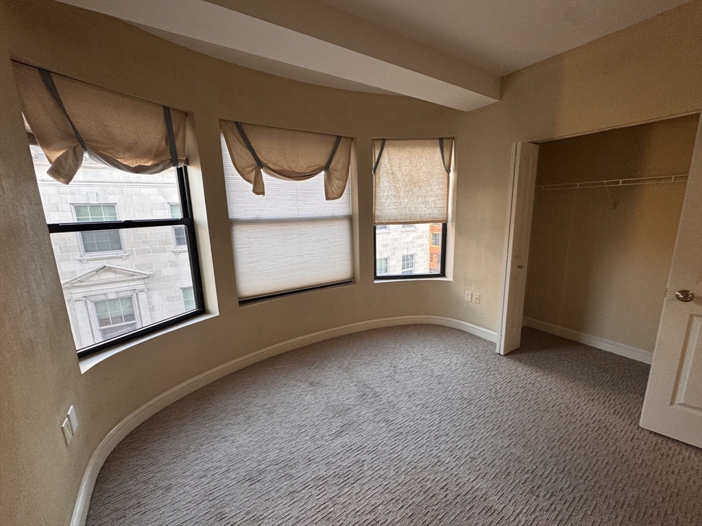 636 Beacon Street, Unit 404 Boston, MA 02215 - Photo 12 of 20 a view of an empty room with a window