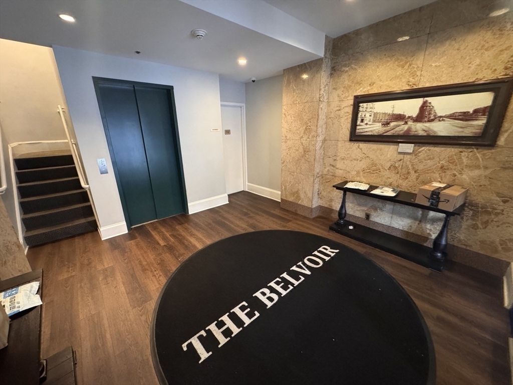 636 Beacon Street, Unit 404 Boston, MA 02215 - Photo 17 of 20 a bedroom with a bed and wooden floor