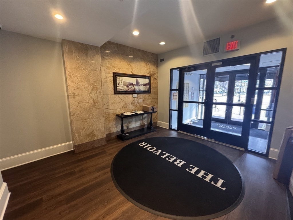 636 Beacon Street, Unit 404 Boston, MA 02215 - Photo 18 of 20 a view of a livingroom with furniture and staircase