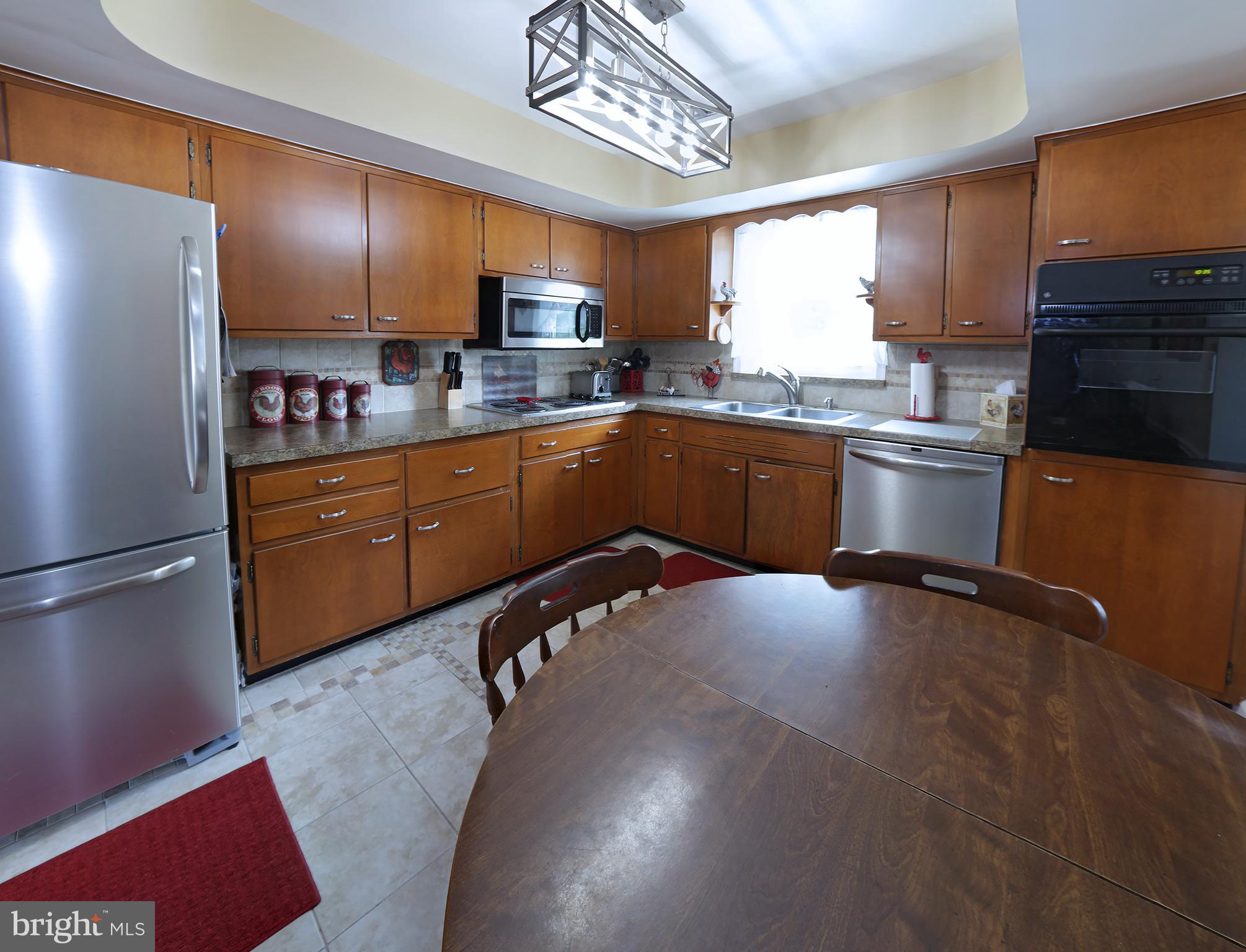 1125 Devonshire Road Lancaster, PA 17601 - Photo 34 of 46 Eat-in kitchen with stainless steel appliances.