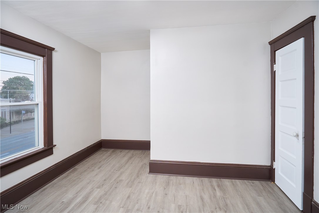 5432 State Road Parma, OH 44134 - Photo 38 of 47 Empty room with light wood finished floors and baseboards