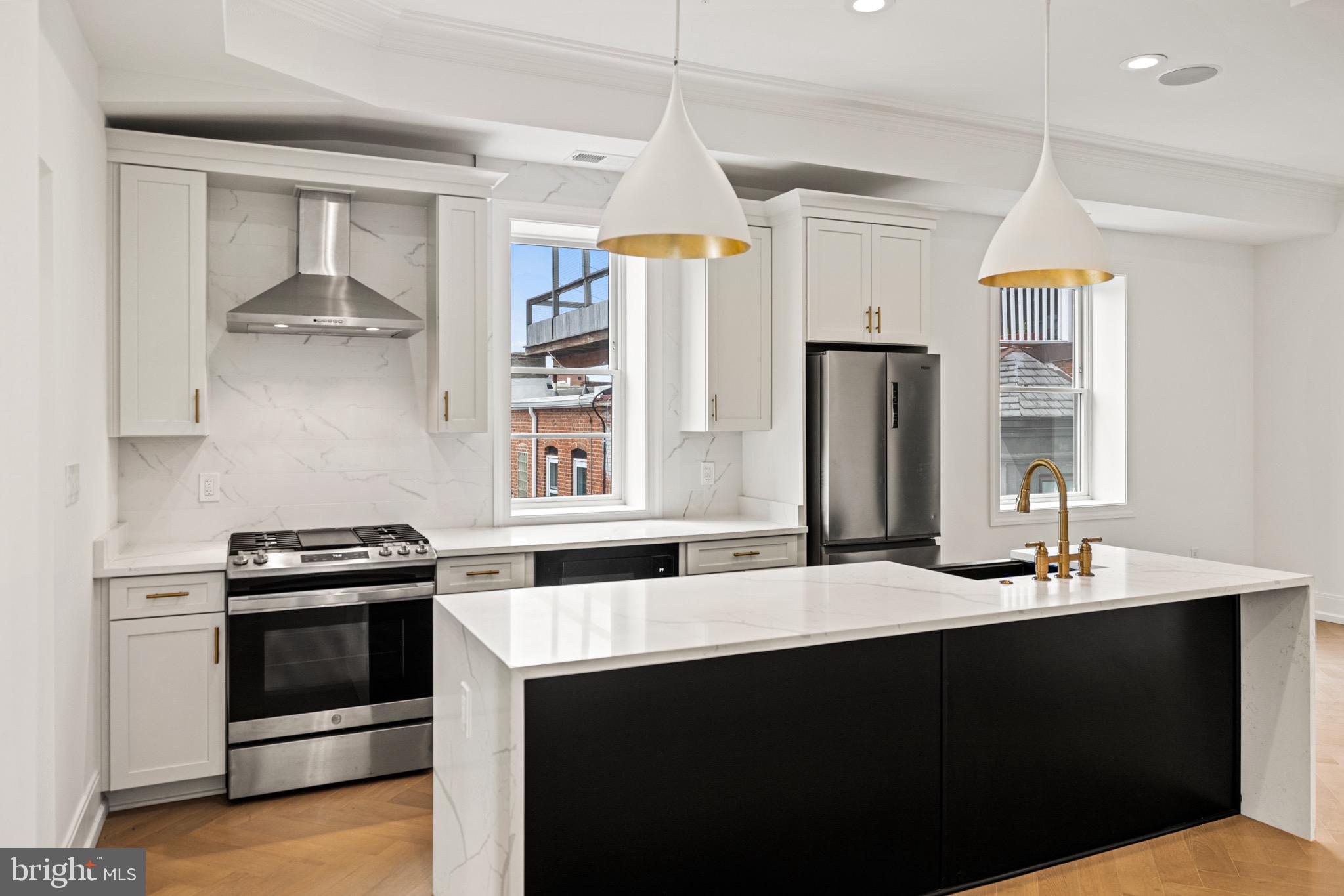 1709 21st Street Northwest, Unit 42 Washington, DC 20009 - Photo 7 of 21 a kitchen with a stove a sink and a refrigerator