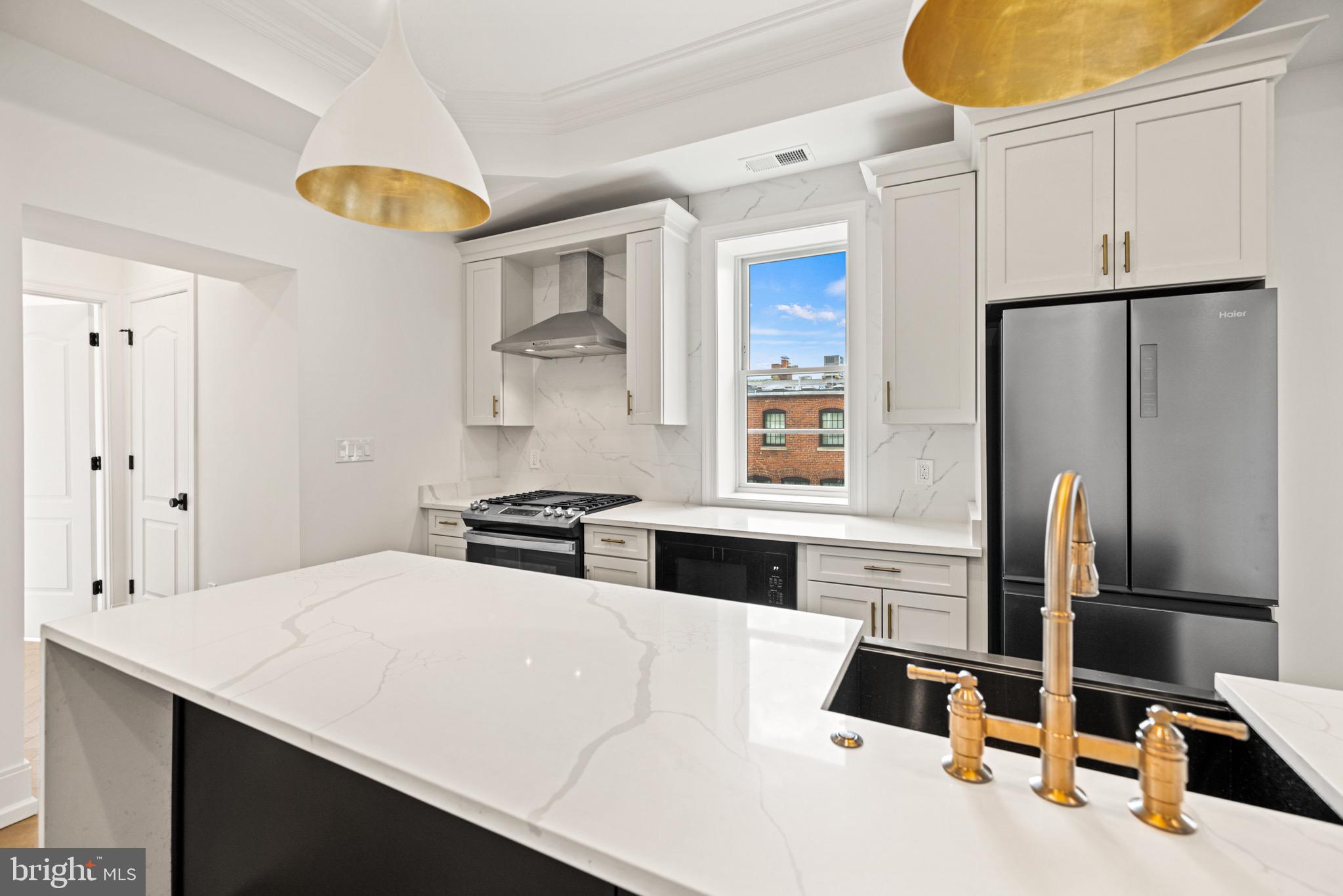 1709 21st Street Northwest, Unit 42 Washington, DC 20009 - Photo 8 of 21 a kitchen with stainless steel appliances a refrigerator and a stove