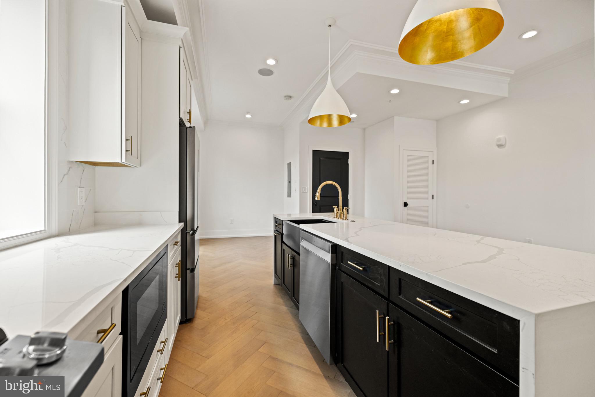 1709 21st Street Northwest, Unit 42 Washington, DC 20009 - Photo 10 of 21 a kitchen with a sink and stove