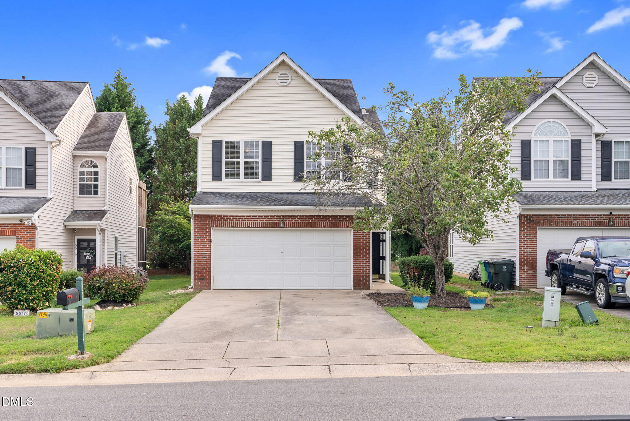 5512 Grand Traverse Drive Raleigh, NC 27604 - Photo 1 of 62 a front view of a house with a yard and garage
