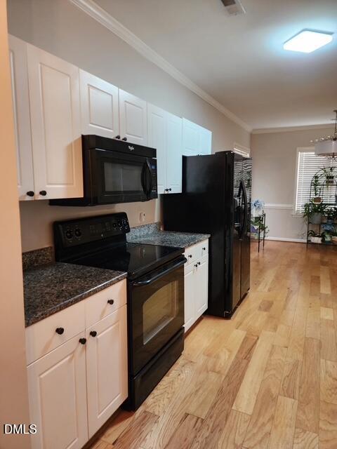 5512 Grand Traverse Drive Raleigh, NC 27604 - Photo 17 of 62 a kitchen with granite countertop a refrigerator and a stove top oven