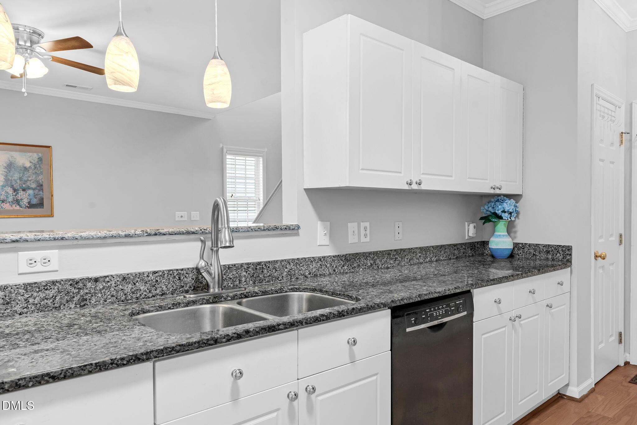 5512 Grand Traverse Drive Raleigh, NC 27604 - Photo 18 of 62 a kitchen with granite countertop a sink and cabinets