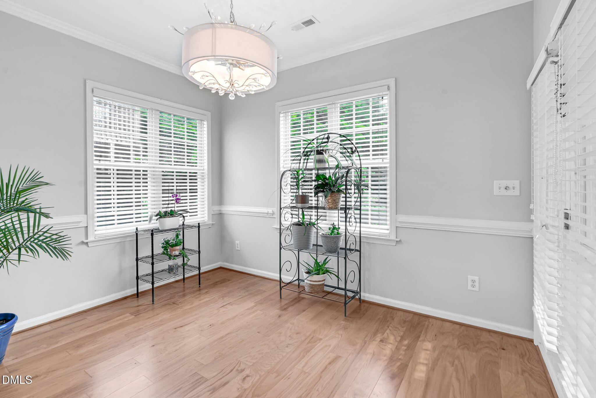 5512 Grand Traverse Drive Raleigh, NC 27604 - Photo 20 of 62 a view of livingroom with hardwood floor and window