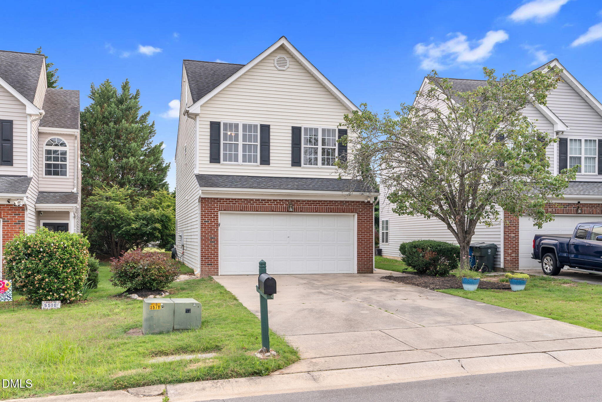 5512 Grand Traverse Drive Raleigh, NC 27604 - Photo 2 of 62 a front view of a house with a yard and garage