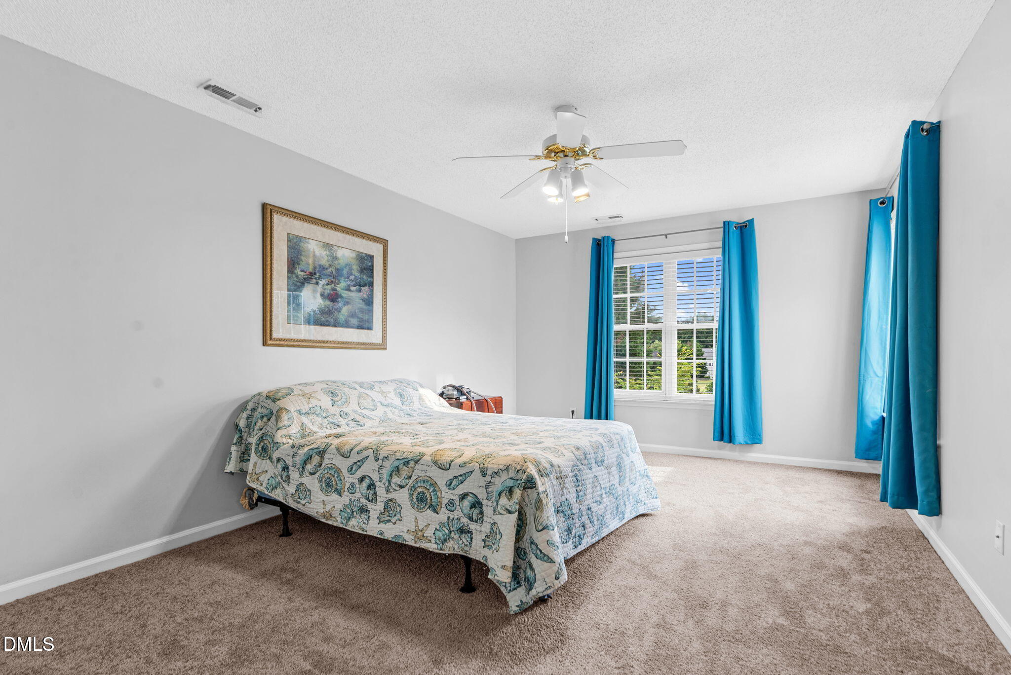 5512 Grand Traverse Drive Raleigh, NC 27604 - Photo 29 of 62 a bed sitting in a spacious bedroom next to a window