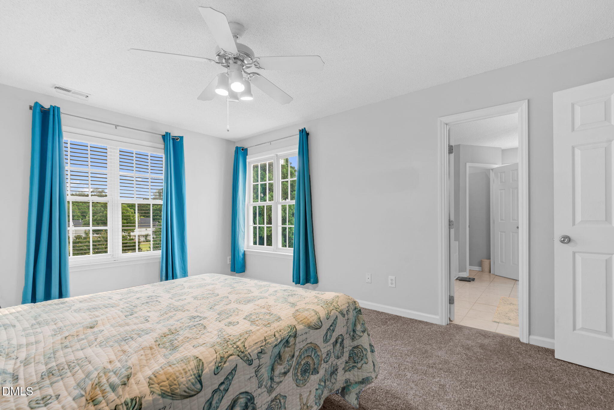 5512 Grand Traverse Drive Raleigh, NC 27604 - Photo 30 of 62 a bedroom with a large bed and a large window