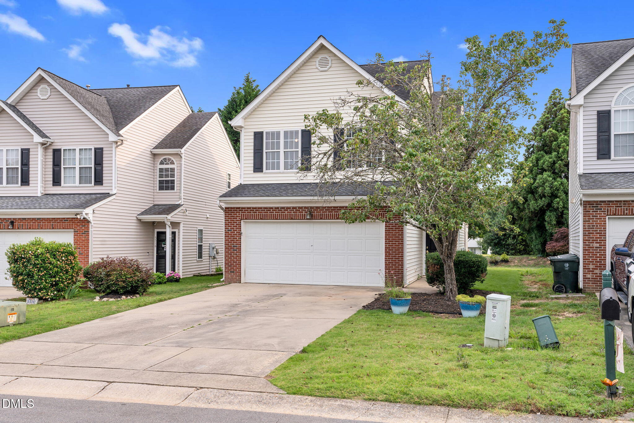 5512 Grand Traverse Drive Raleigh, NC 27604 - Photo 3 of 62 a front view of a house with a yard and trees